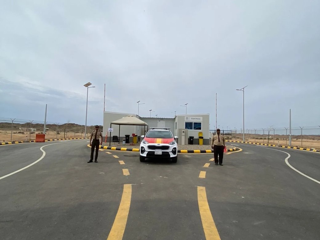 Artal patrol vehicle and guards at a site checkpoint